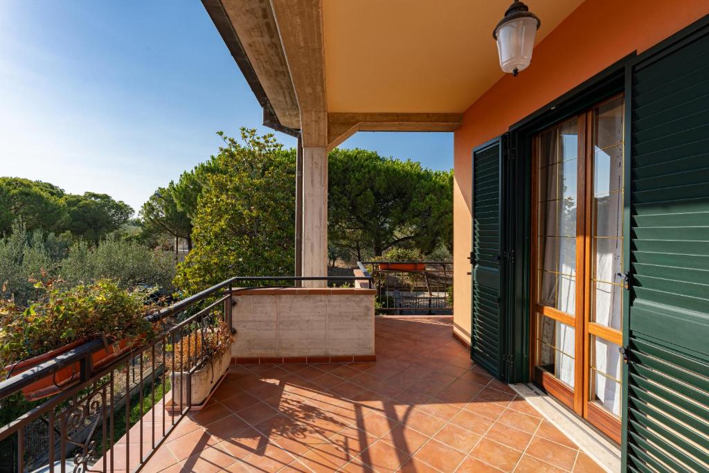 an outside balcony of a house with a patio at Vecchia San Giovanni - YourPlace Abruzzo in Fossacesia