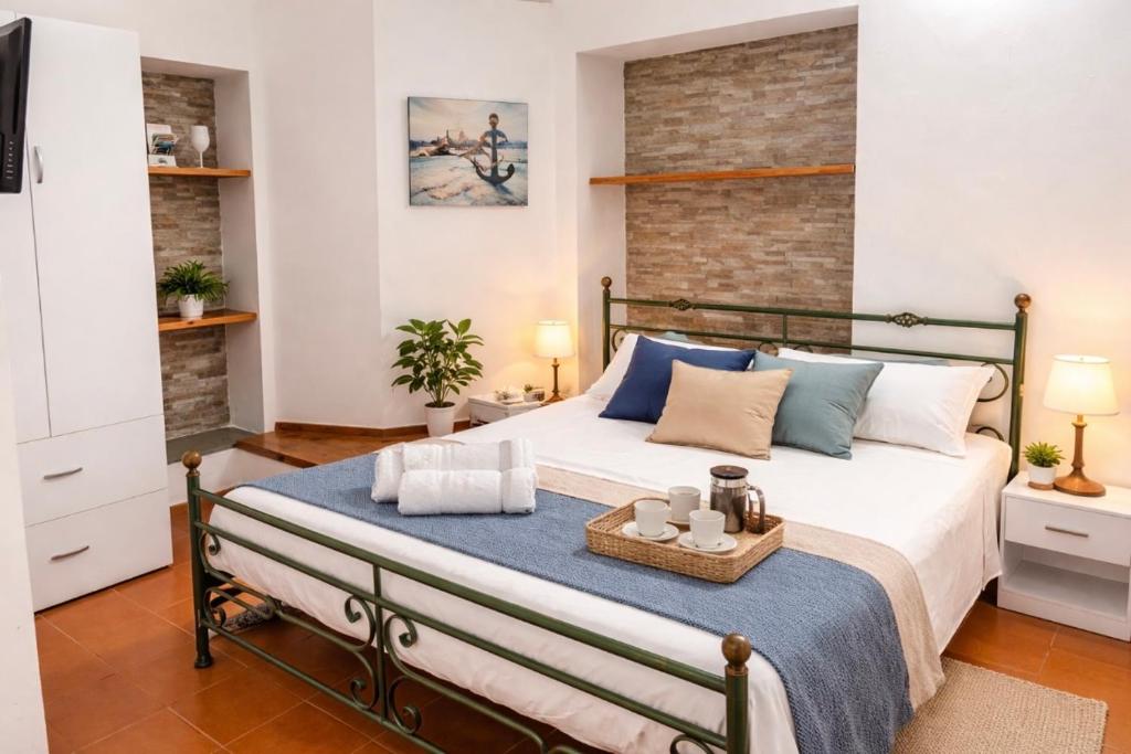 a bedroom with a large bed with a tray on it at Il Portale 2 in Tropea