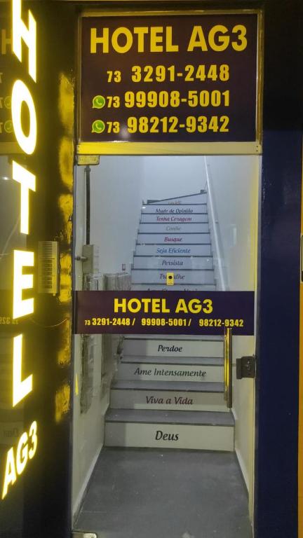 a ticket entrance to a hotel room with stairs at Hotel AG3 in Teixeira de Freitas