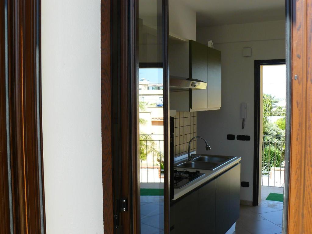 A kitchen or kitchenette at Oasi Tortuga Residence Piscina e barbecue h24