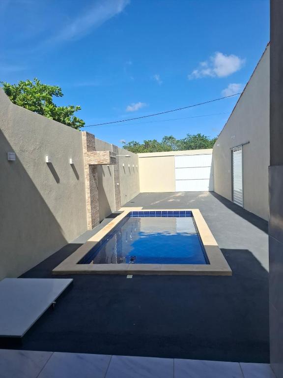 a swimming pool on the side of a house at Casa Lagoar in Jijoca de Jericoacoara