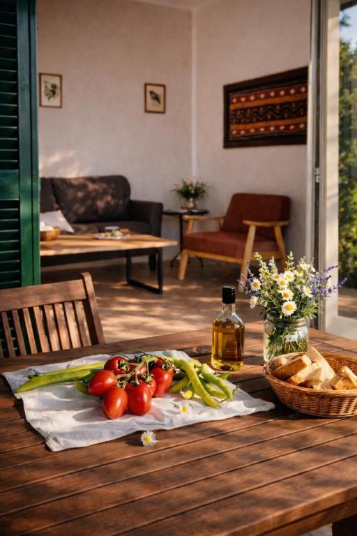 a table with tomatoes and vegetables on top of it at Agriturismo Il Querciolo in Grosseto