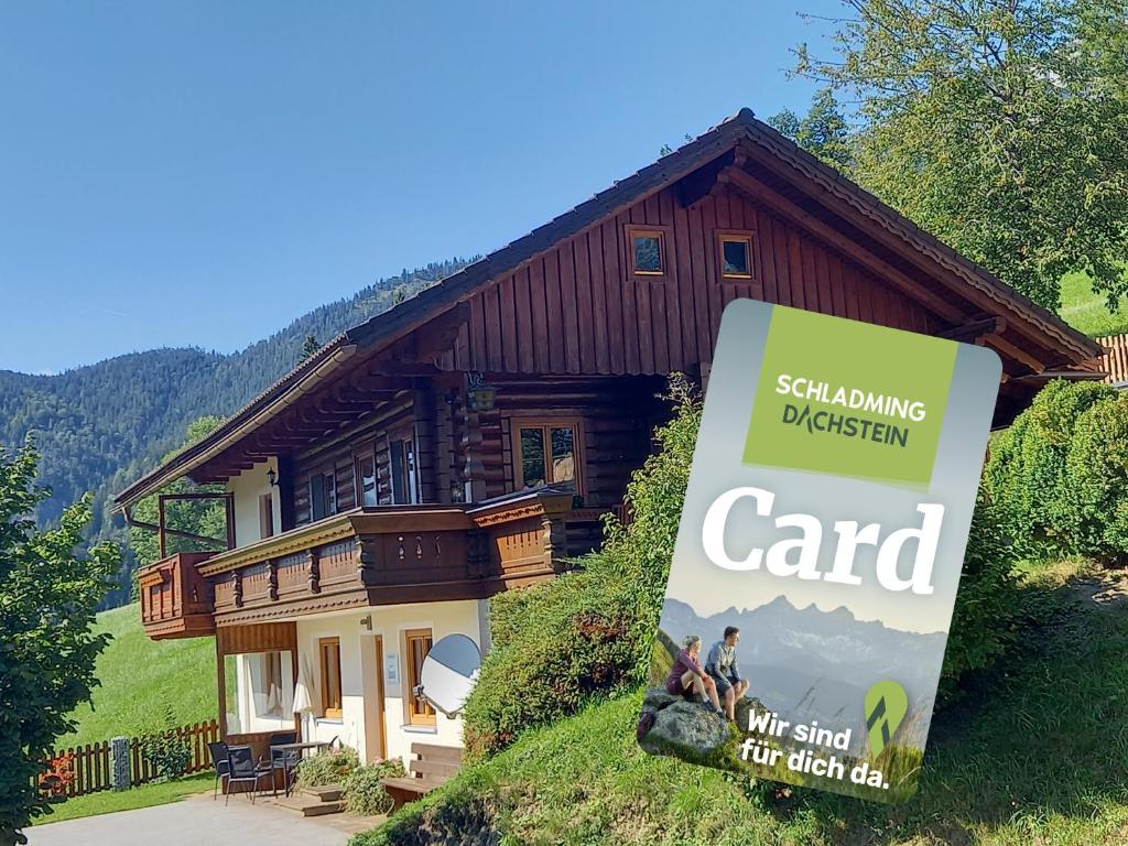 a house with a sign in front of it at Ferienhaus Schwab in Aich