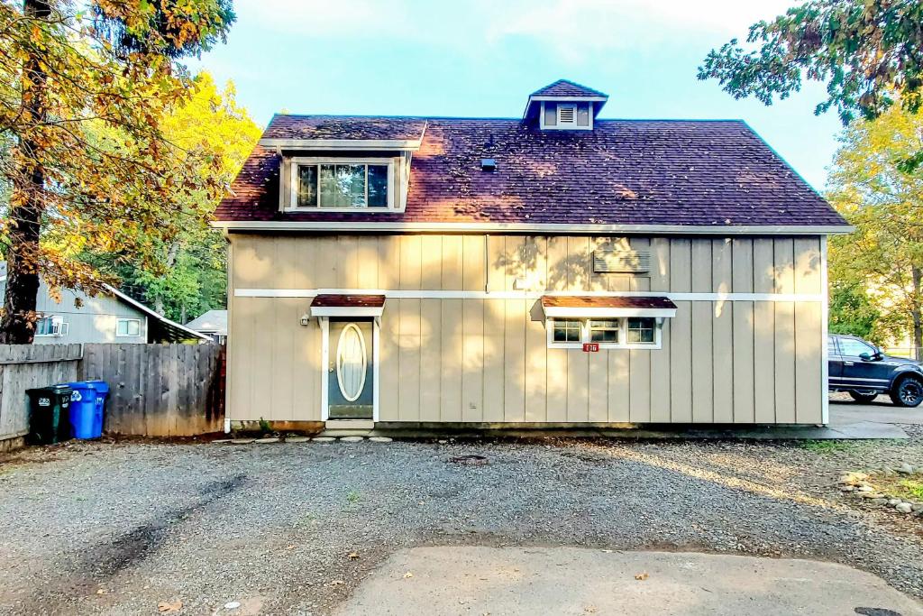 a small white garage with a roof at Explore Caves & Coast! Family-Friendly Oregon Stay in Cave Junction