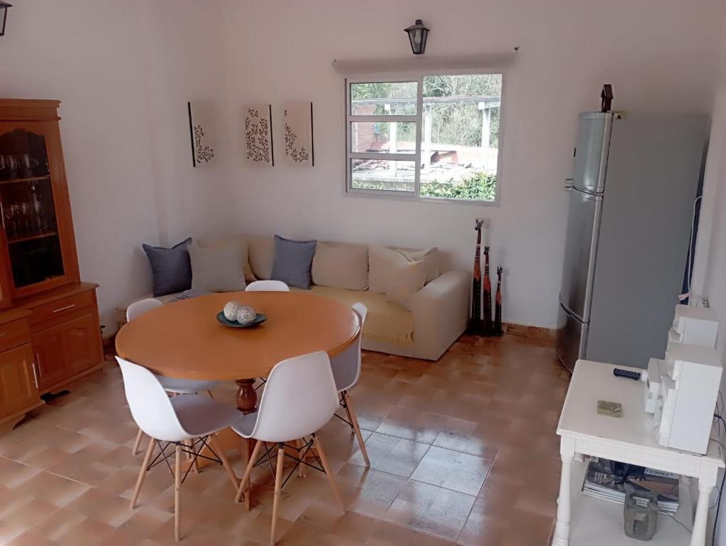 a living room with a table and a couch at Rincon Del Colibri in Reyes