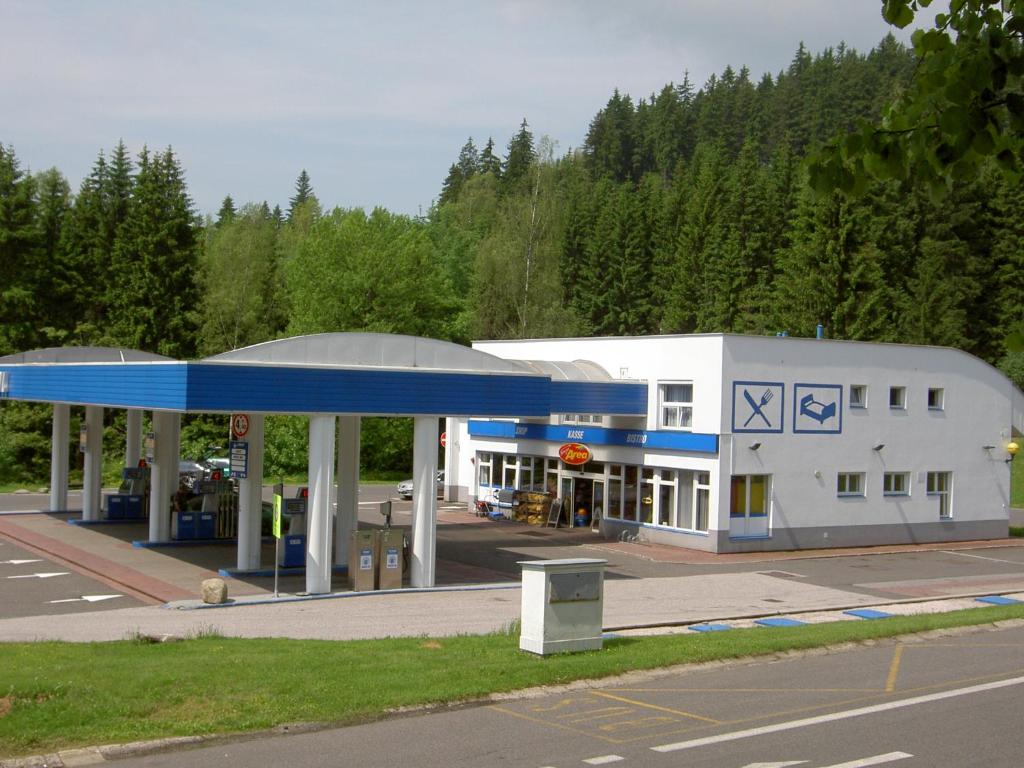 a gas station with a blue and white building at ČS RoBiN OIL Harrachov in Harrachov