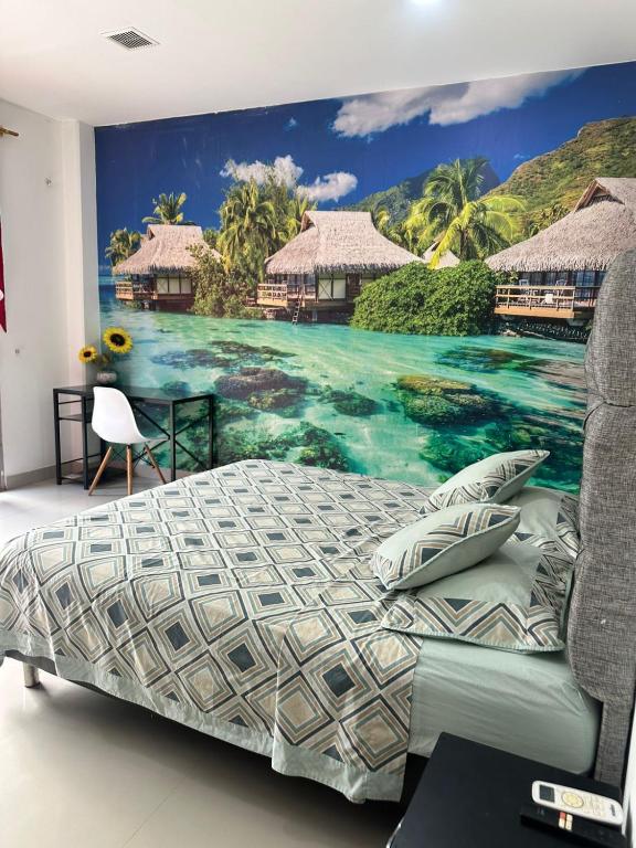 a bedroom with a mural of a resort at APARTAMENTO CONFORTABLe 200 in Arauca