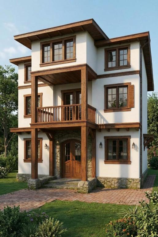 a large house with a balcony on top of it at Gegë Boutique Hotel in Gjakove