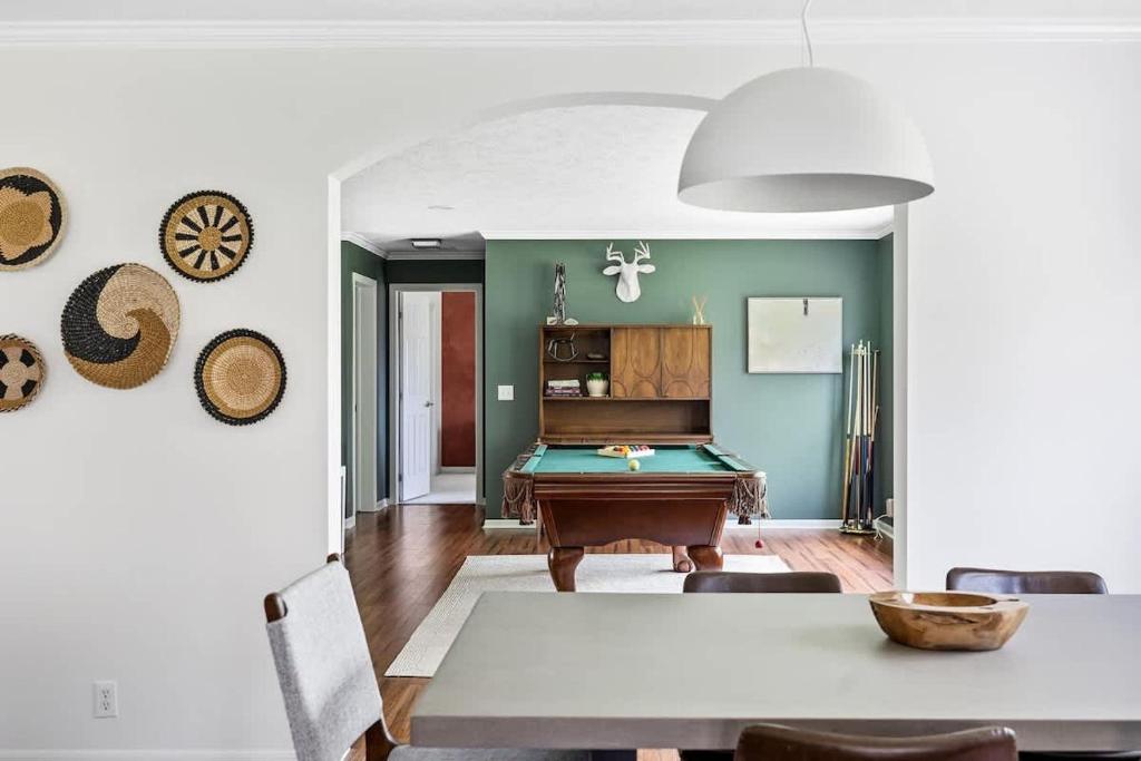 a living room with a pool table in it at The Birdcage by Juniper Holiday + Home in Douglas