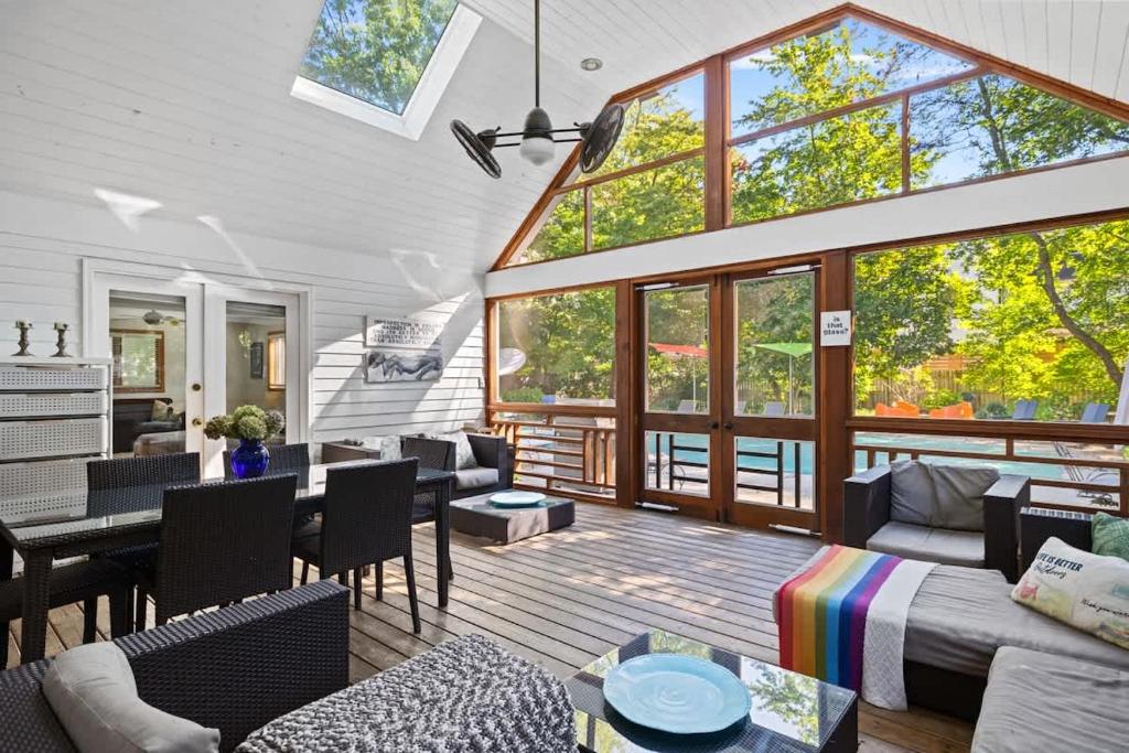 a living room filled with furniture and a large window at Casa Azur by Juniper Holiday + Home in Union Pier