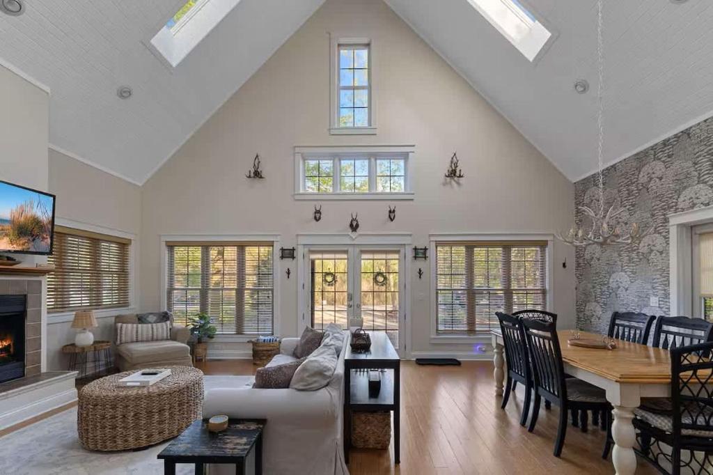 a living room with a couch and a table at Deer Haus by Juniper Holiday + Home in New Buffalo