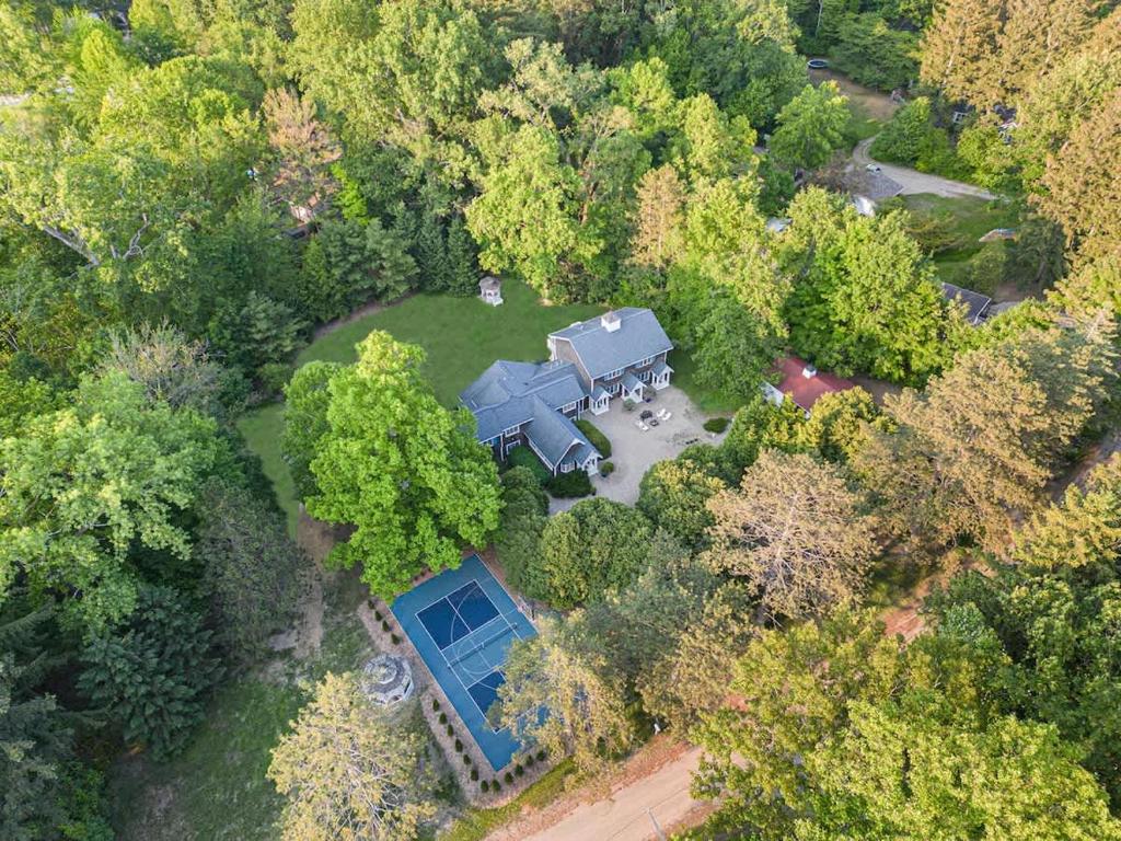 an overhead view of a large house with a blue house at Rabbit Run by Juniper Holiday + Home in Sawyer