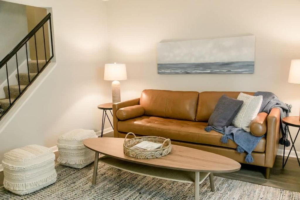 a living room with a couch and a table at Perfect Small Family Beach Condo in Saint Simons Island