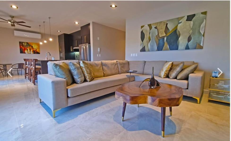 a living room with a couch and a table at Escape to Paradise in Tangolunda