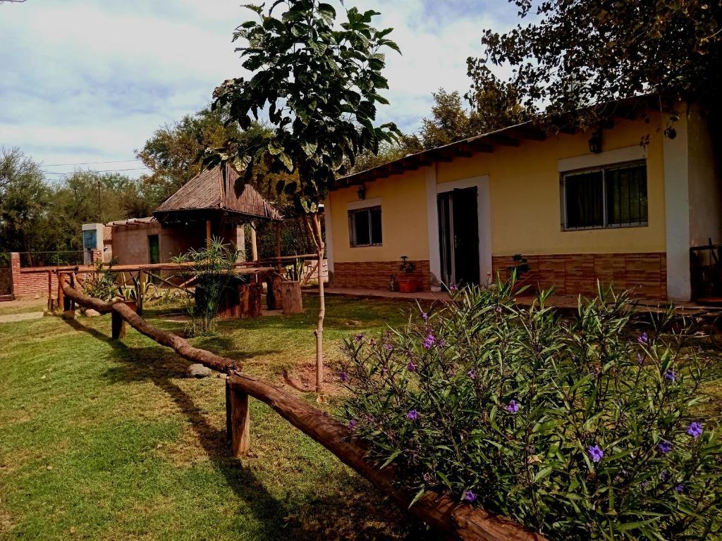 a house with a fence in front of it at cabaña huguito y vane in Tinogasta