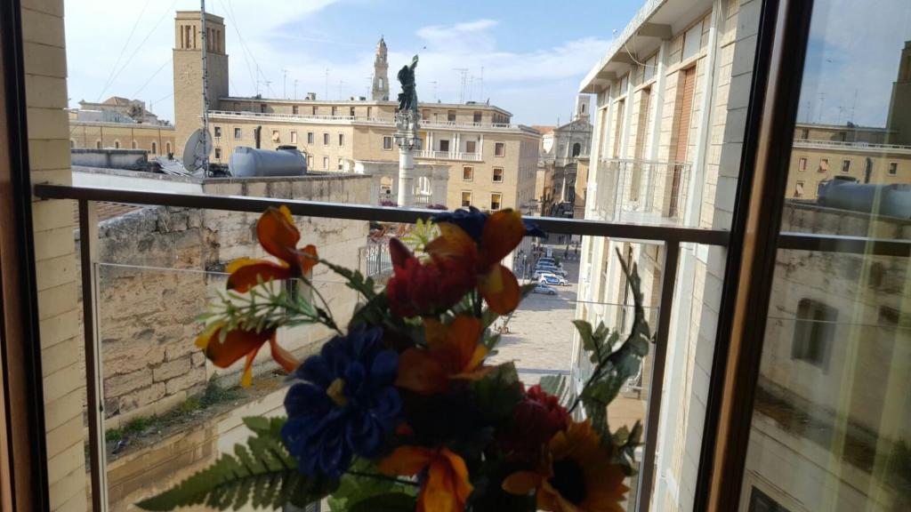 a window with a view of a city at Sant'Oronzo B&B in Lecce