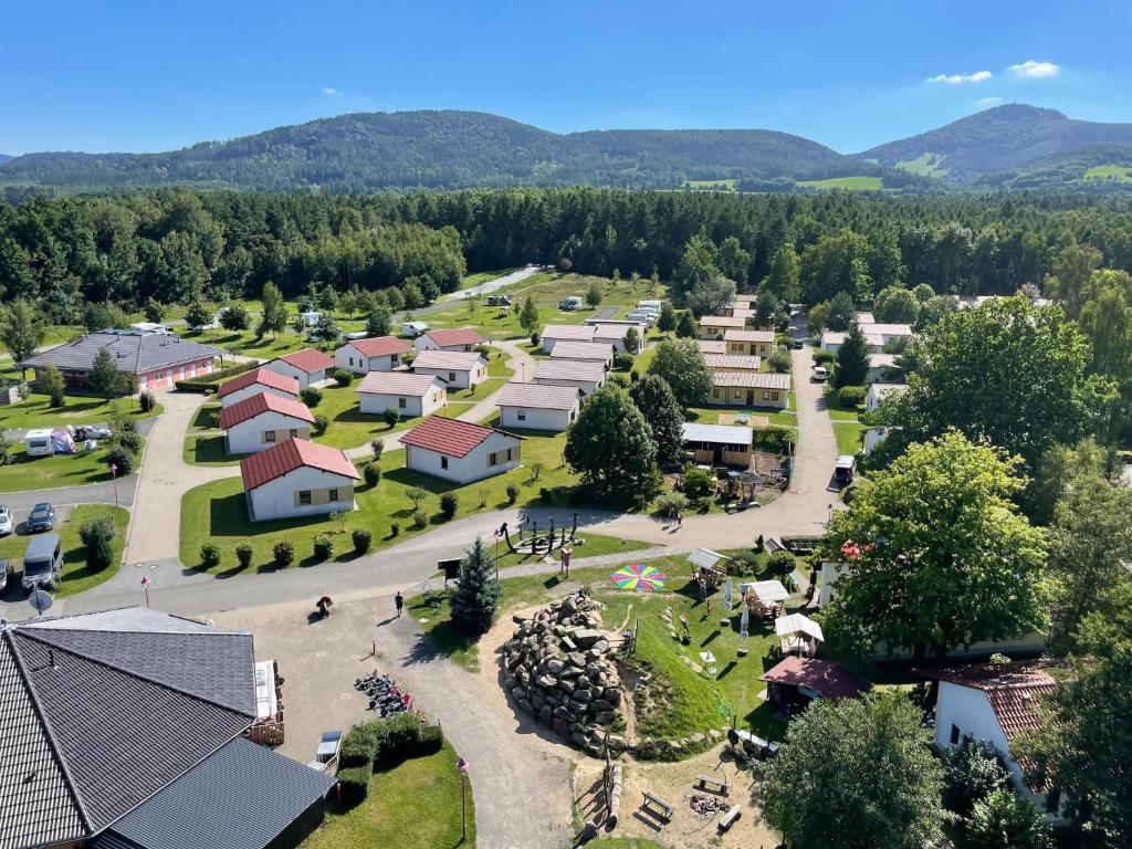 an aerial view of a village with a park at Ferienhaus im Trixi Ferienpark in Großschönau