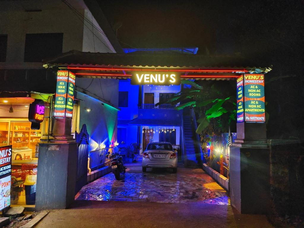 a car parked in front of a garage at night at Venu's Homestay in Varkala
