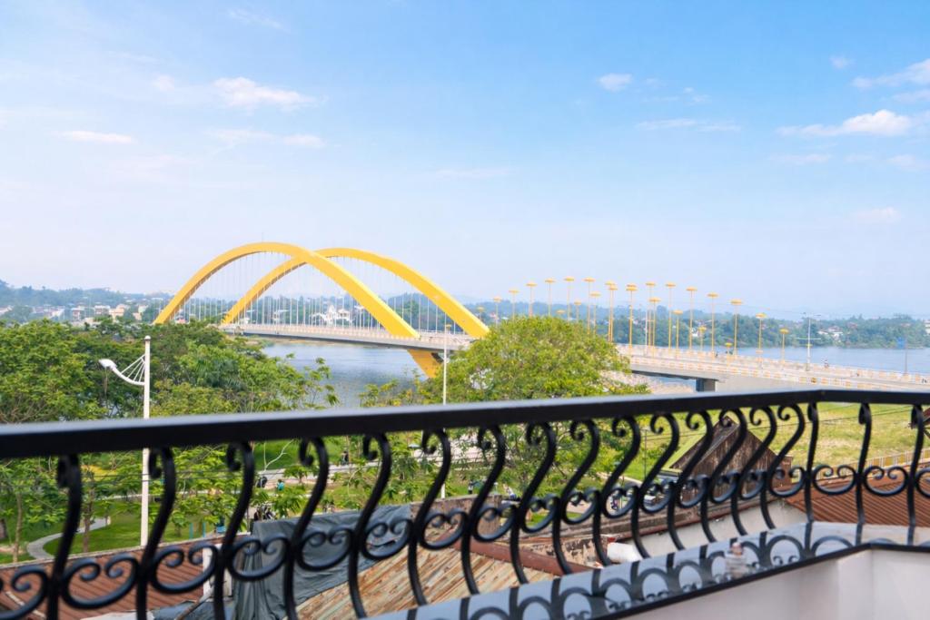 a balcony with a view of a roller coaster at ICHI Home Kim Long in Hue