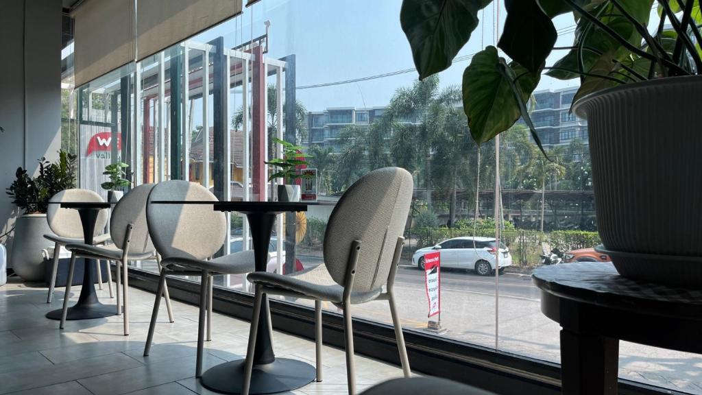 Window-side lounge seating overlooking a busy street.