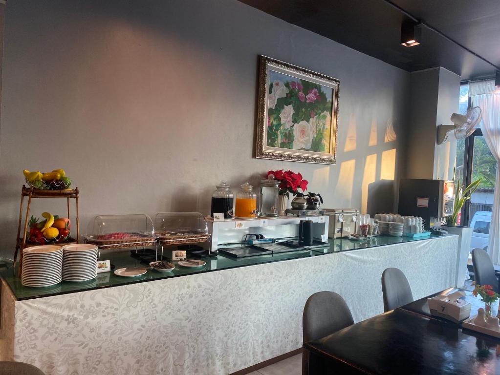 A compact self-service breakfast counter beside the dining area.