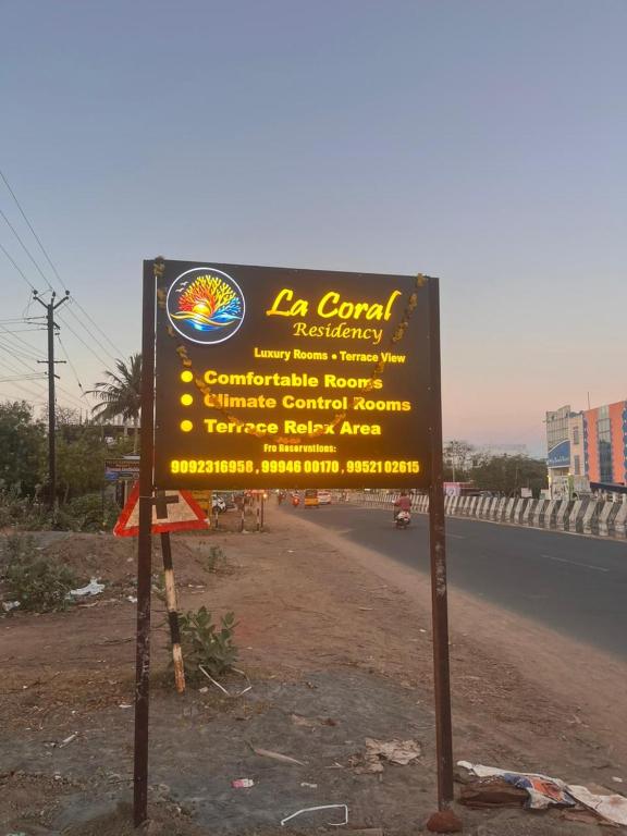 a sign on the side of a road at La Coral Residency in Pondicherry