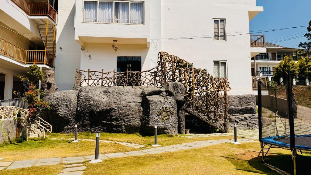 a statue of an elephant in front of a building at Skylark Holidays Chinnakanal in Chinnakanal