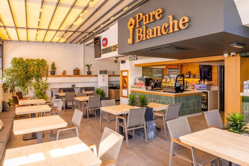 a dining room with tables and chairs in a restaurant at Pure Blanche Hotel in Antalya