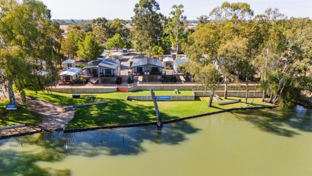 an aerial view of a house next to a river at Rivergardens Holiday Park Mildura in Gol Gol