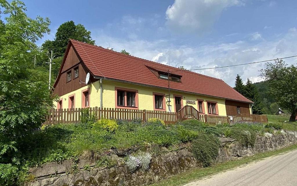 a house with a red roof on the side of a road at Chalupa ALMA in Žacléř