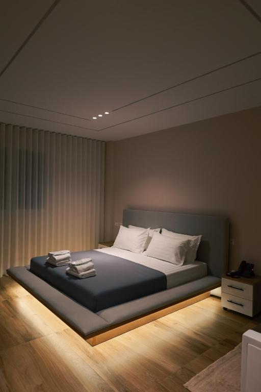 a bedroom with a large bed with white pillows at STAR Hotel in Bathore