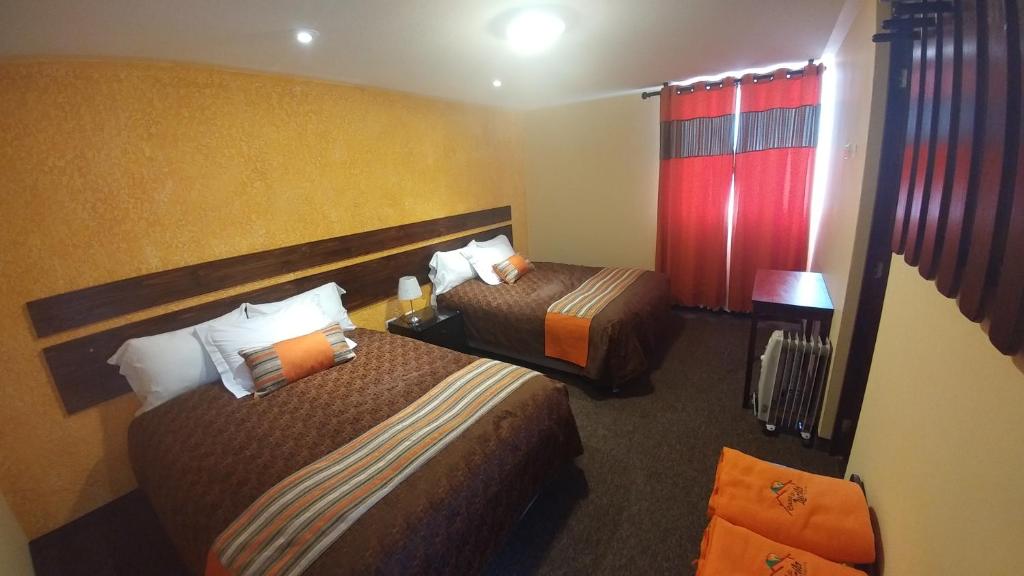 Postel nebo postele na pokoji v ubytování Vita Hoteles Colca