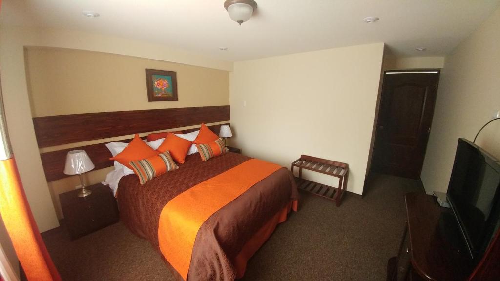 Postel nebo postele na pokoji v ubytování Vita Hoteles Colca