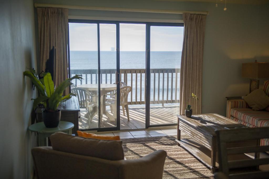 a living room with a view of the ocean at Sea Mystique Resort in Myrtle Beach