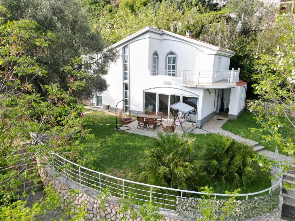 an aerial view of a white house with a fence at Vila Brca in Brca
