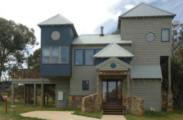 a large house with a blue and gray at Blue Sky Lodge in Dinner Plain