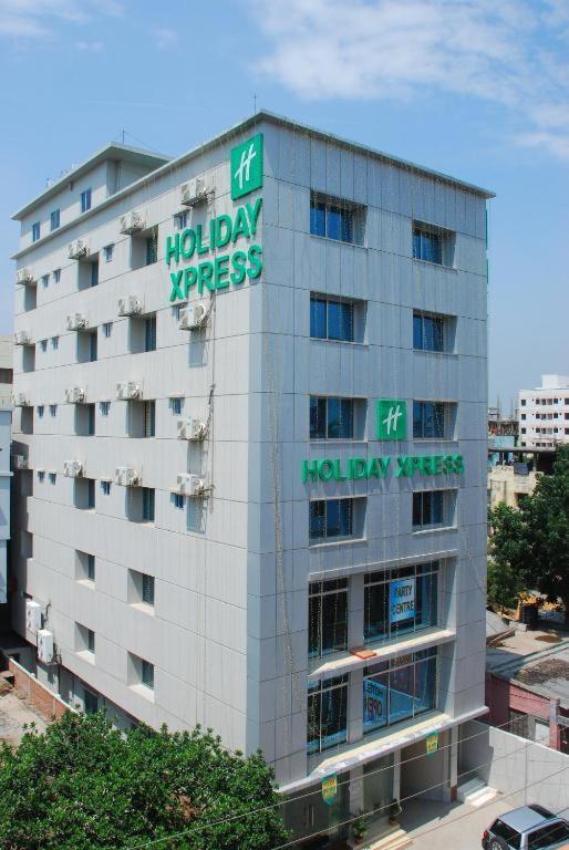 a building with a hiltonasy express sign on it at Holiday Xpress in Dhaka