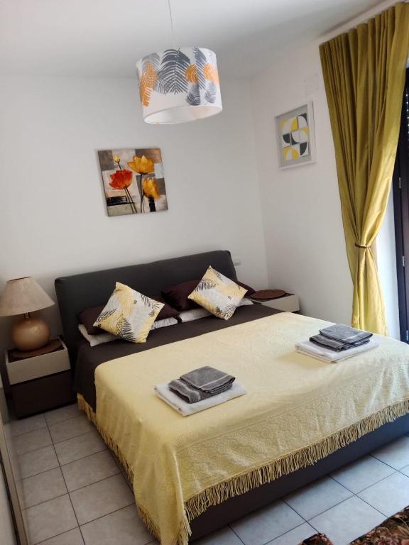 a bedroom with a bed with two towels on it at Casa Cesano mare in Senigallia