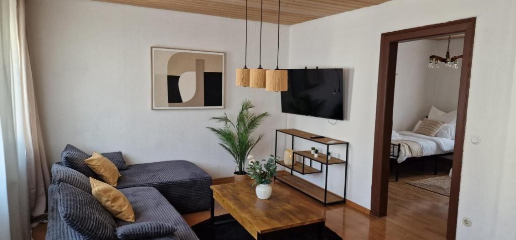 a living room with a couch and a table at M B Homes Albstadt in Albstadt