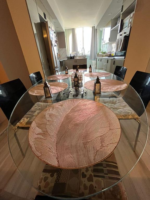 a conference room with four wooden tables and chairs at Sousse appartement zone touristique in Sousse