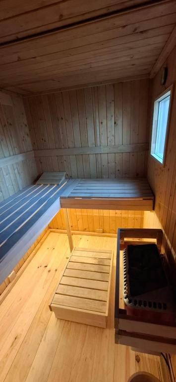 a small room with a bed in a cabin at Le Square Inn in Turckheim