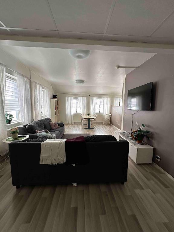 a living room with a couch and a table in it at Sörbyvägen 4 in Floby