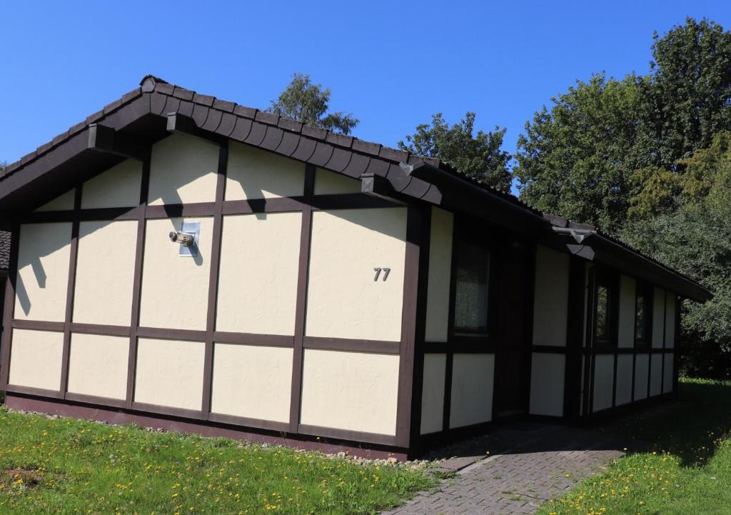 a garage with two garage doors on it at Ferienhaus Mooswinkel in Waldbrunn