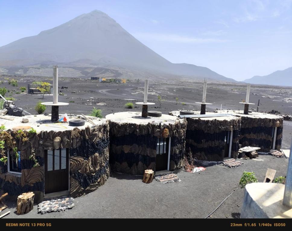 a group of buildings with a view of a mountain at Pensao Zé Doce in Portela