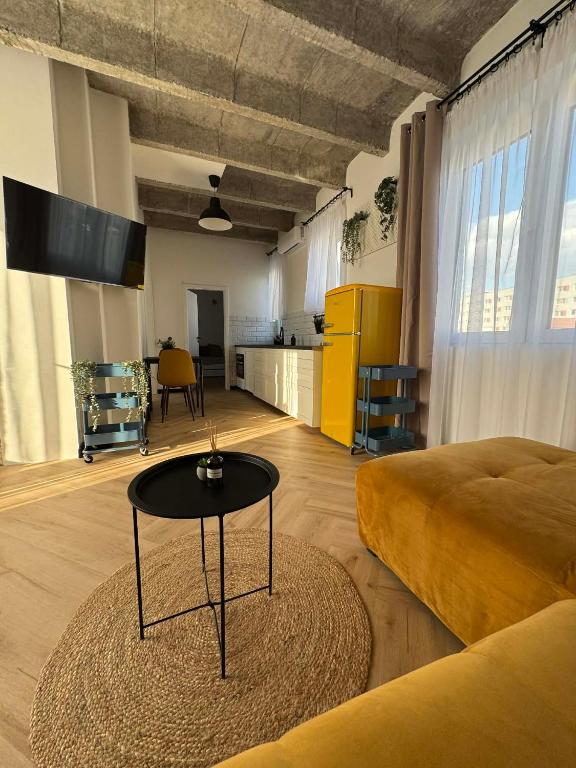 a living room with a bed and a table at Old Town, The Reward apartment with terrace with a view in Staré Mesto