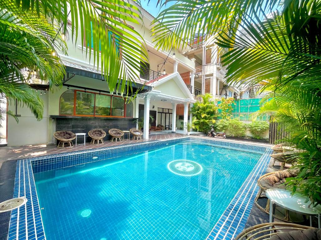 a swimming pool in the middle of a house at Sky Heritage Hotel in Phnom Penh
