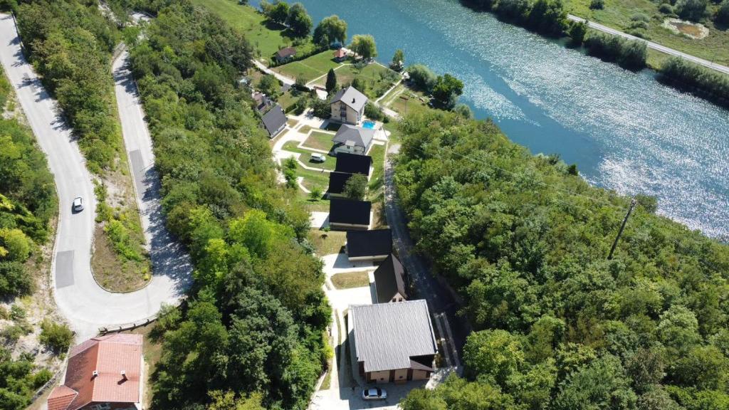 an aerial view of a house next to a river at Mountain Holiday Homes in Kostel