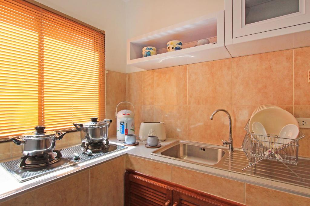 Kuchyň nebo kuchyňský kout v ubytování Soleil D'asie Residence