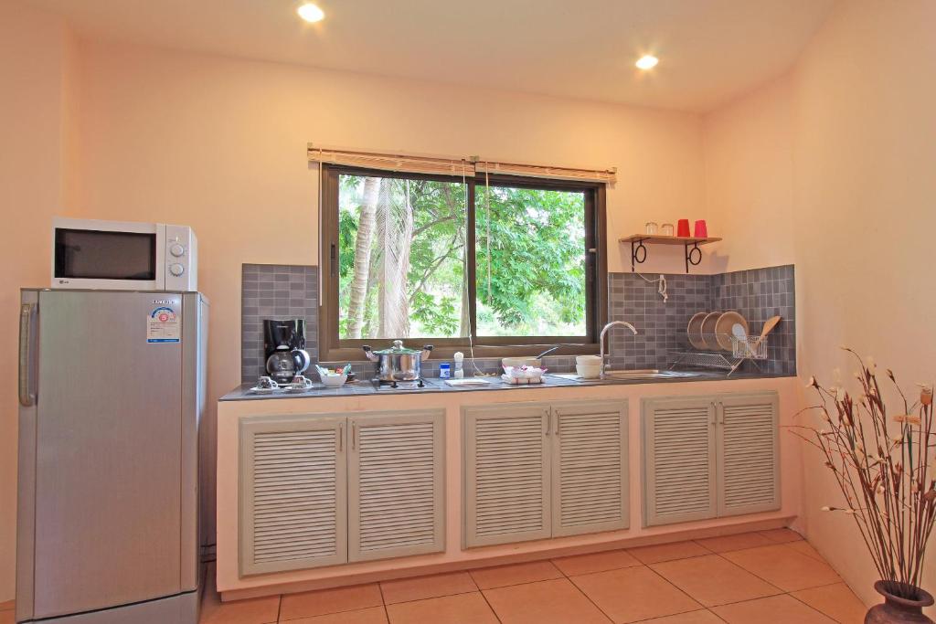 Kuchyň nebo kuchyňský kout v ubytování Soleil D'asie Residence