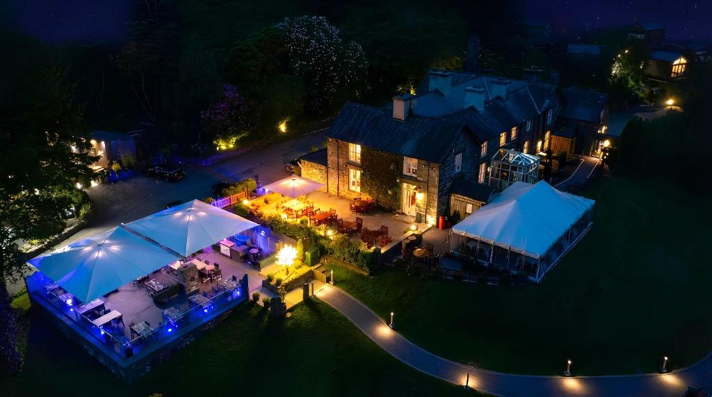 an aerial view of a house at night at Aberdunant Hall Holiday Park, Snowdonia in Porthmadog